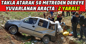 Uşak'ta dereye uçan araçta sıkışan çifti itfaiye ekipleri kurtardı